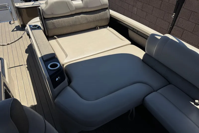 Slide: The Image of Luxurious seating area on 2023 Avalon Catalina VRBW boat with cup holders and plush cushions. - 17