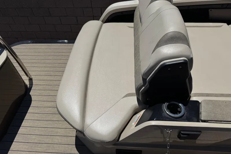 Slide: The Image of 2023 Avalon Catalina VRBW boat seat with beige upholstery and integrated cup holder. - 18