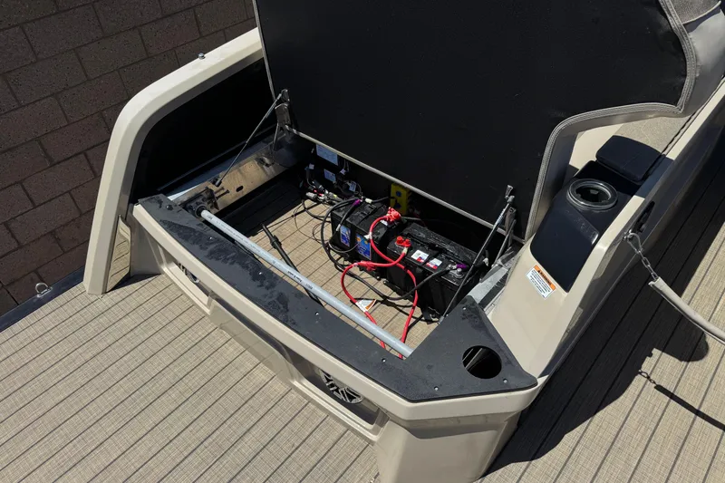 Slide: The Image of 2023 Avalon Catalina VRBW boat battery compartment with open hatch, showing wiring and components. - 19