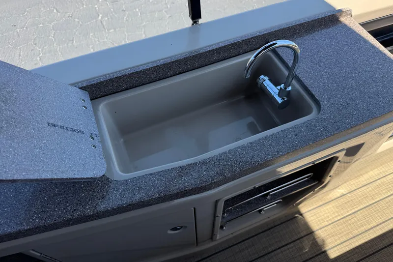 Slide: The Image of 2023 Avalon Catalina VRBW boat sink with modern faucet and countertop. - 25