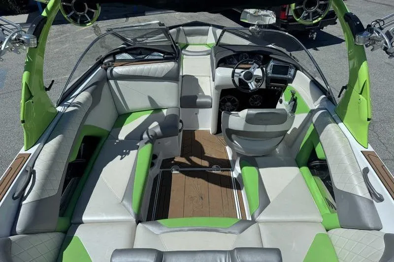 Slide: The Image of 2015 Tigé Z1 boat interior with green accents and modern design. - 13