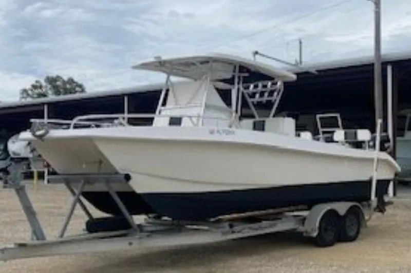 The Image of 2016 Twin Vee 26 Center Console boat on trailer with Suzuki outboard motor. - 0