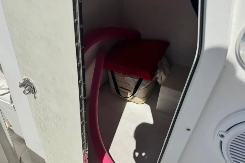 Slide: The Image of Interior view of 2016 Twin Vee 26 Center Console boat storage compartment. - 10