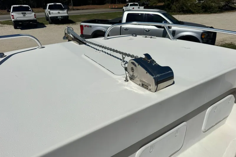 Slide: The Image of 2016 Twin Vee 26 Center Console boat with anchor winch on deck. - 12