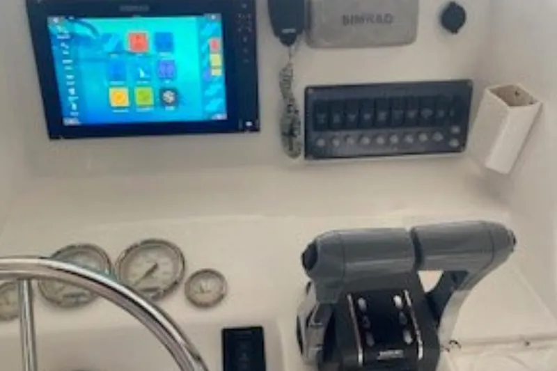 Slide: The Image of 2016 Twin Vee 26 Center Console boat with rod holders and spacious deck. - 5