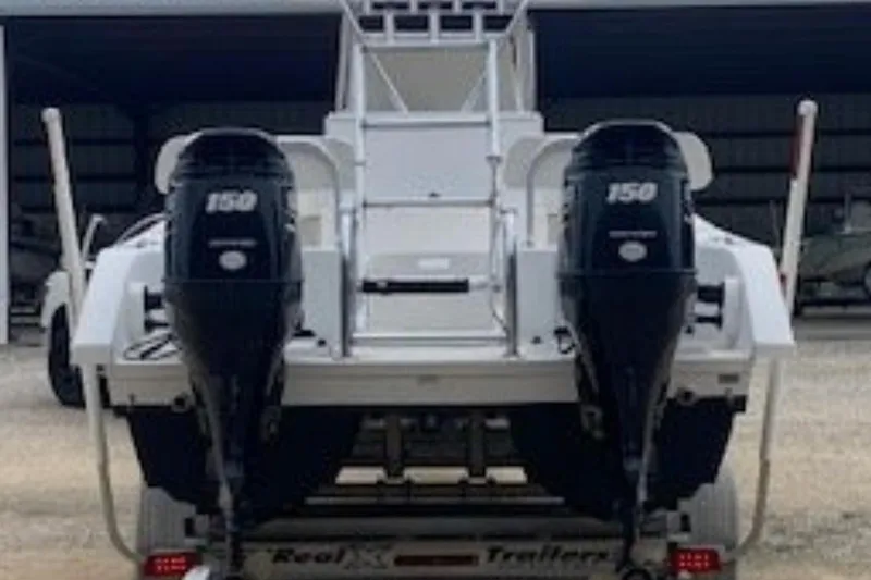 Slide: The Image of 2016 Twin Vee 26 Center Console boat helm with steering wheel and controls. - 7