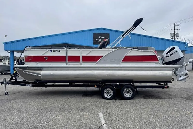 The Image of 2022 Trifecta SS 23RF pontoon boat with Honda motor on trailer. - 1