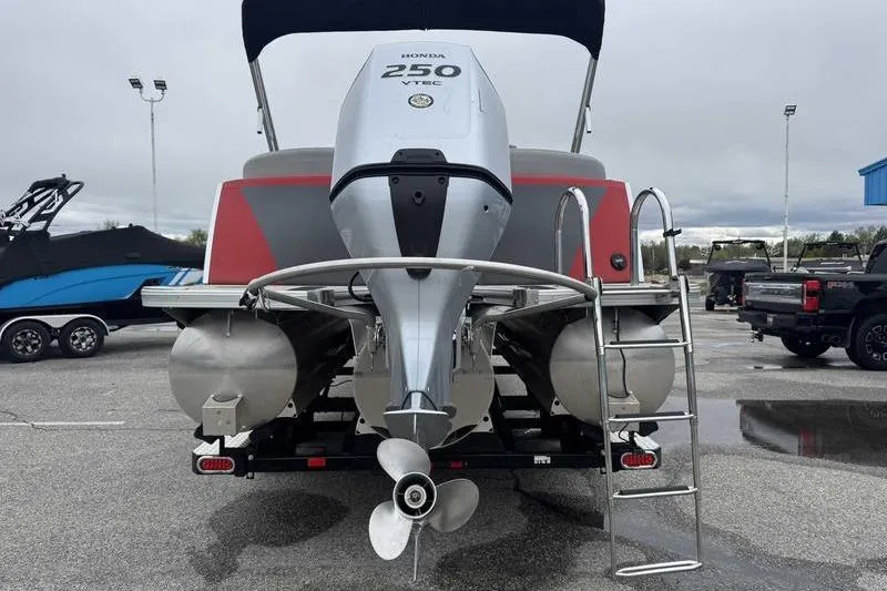 Slide: The Image of 2022 Trifecta SS 23RF pontoon boat with Honda 250 VTEC engine, rear view. - 10