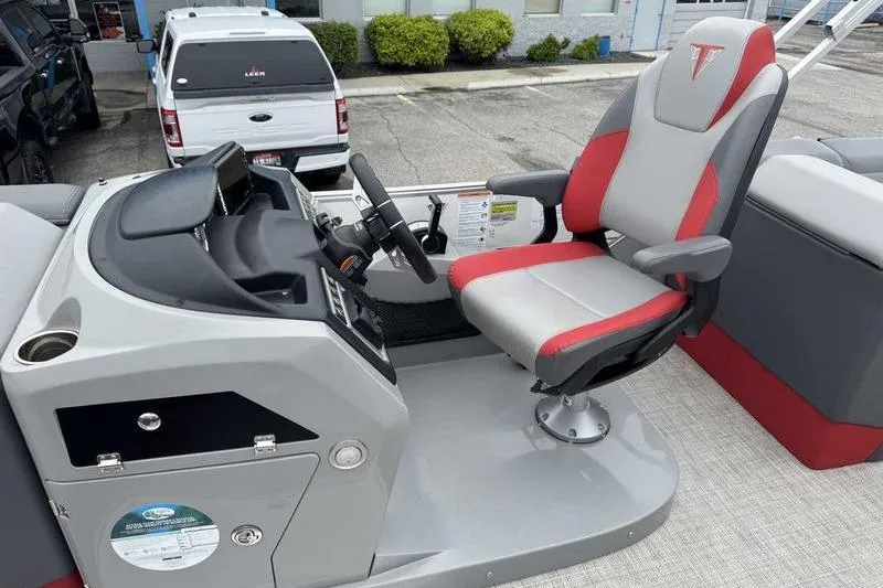 Slide: The Image of 2022 Trifecta SS 23RF boat helm with modern steering and comfortable captain's chair. - 14