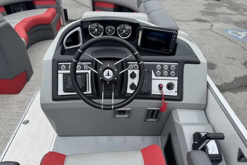 Slide: The Image of 2022 Trifecta SS 23RF boat dashboard with steering wheel and control panel. - 8