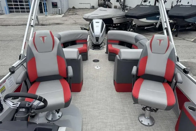 Slide: The Image of 2022 Trifecta SS 23RF pontoon boat interior with red and gray seating. - 9