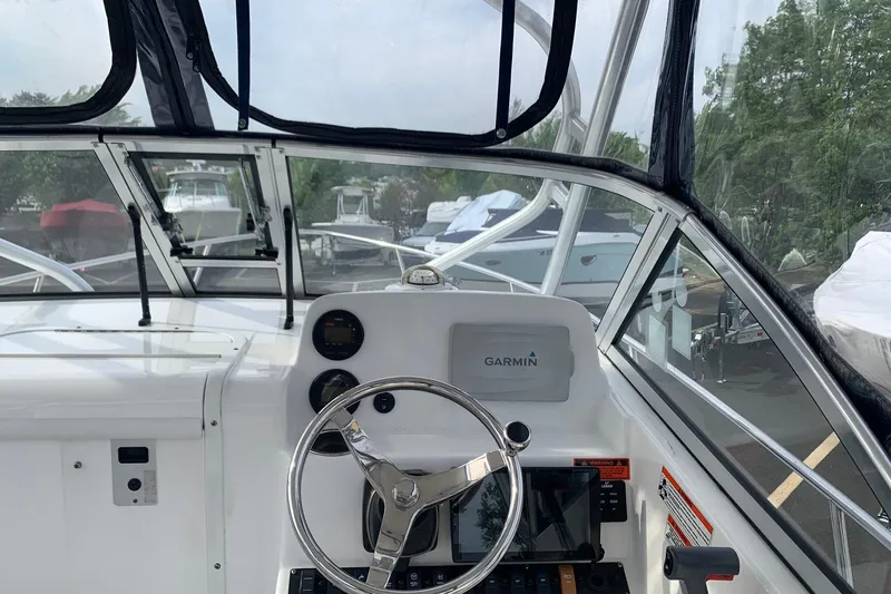 Slide: The Image of Interior view of 2014 Sea Hunt Victory 225 boat cockpit with Garmin navigation system. - 6