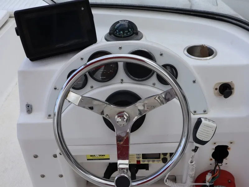 Slide: The Image of Steering console of a 2005 Sea Fox 206 DC boat. - 16