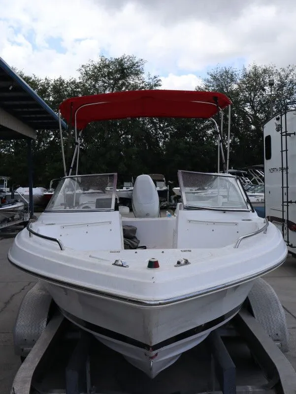 Slide: The Image of 2005 Sea Fox 206 DC boat with red canopy on trailer. - 3