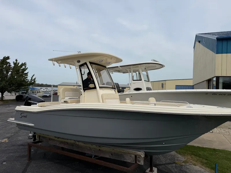 Slide: The Image of A 2027 Scout 220 XSF boat is parked on a lot. It features a sleek design. - 19