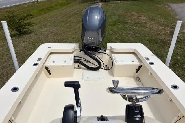Slide: The Image of 2026 Jones Brothers Bateau 20 boat with outboard motor and steering console. - 7