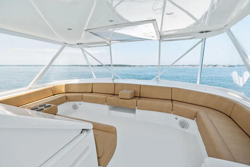 Slide: The Image of Luxurious seating area on 2006 Hatteras 68 Convertible yacht with ocean view. - 28