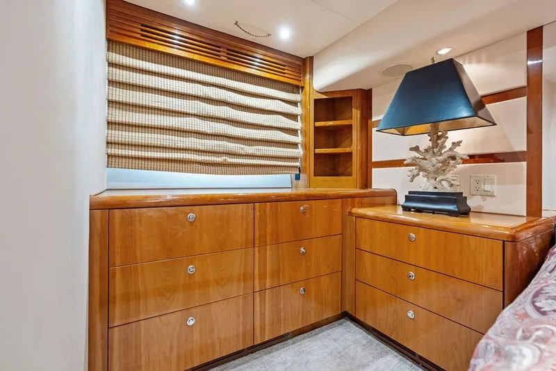 Slide: The Image of Luxurious wooden cabinetry and lamp in 2006 Hatteras 68 Convertible yacht interior. - 47