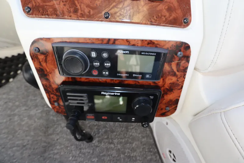 Slide: The Image of Control panel of 2005 Meridian 459 Motoryacht with Fusion and Raymarine devices. - 21