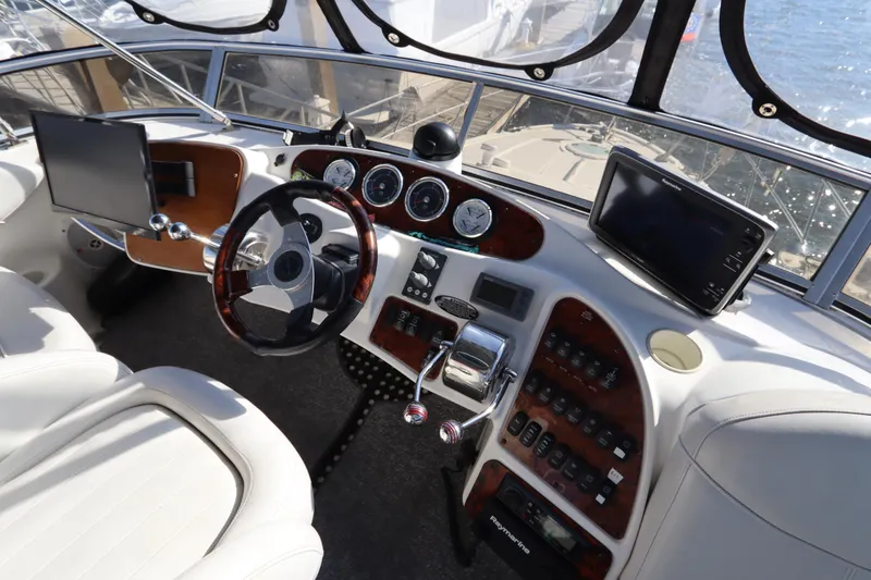 Slide: The Image of 2005 Meridian 459 Motoryacht helm with modern navigation equipment and luxurious controls. - 23