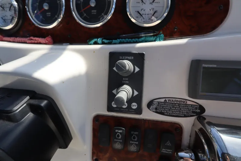 Slide: The Image of Control panel of 2005 Meridian 459 Motoryacht with gauges and switches. - 24