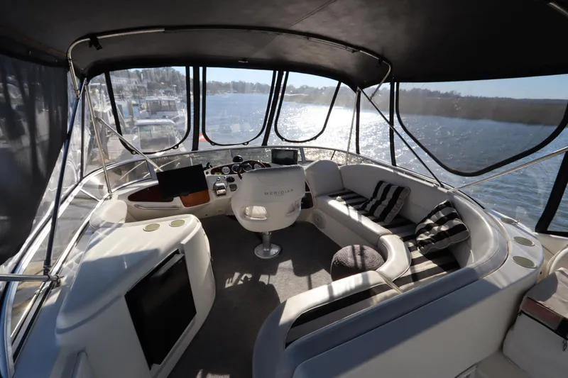 Slide: The Image of Luxurious 2005 Meridian 459 Motoryacht interior with panoramic windows and plush seating. - 30