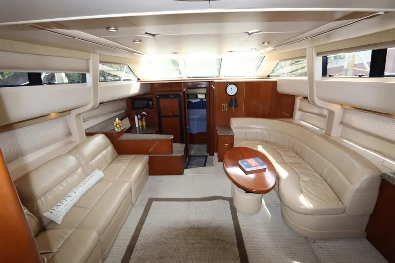 Slide: The Image of Luxurious interior of 2005 Meridian 459 Motoryacht with beige leather seating and wooden accents. - 34