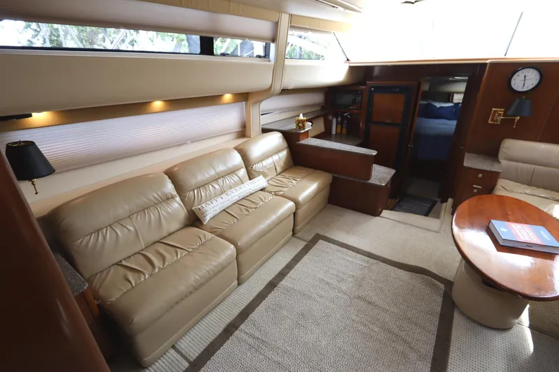 Slide: The Image of Luxurious interior of 2005 Meridian 459 Motoryacht with beige leather seating and wooden accents. - 35