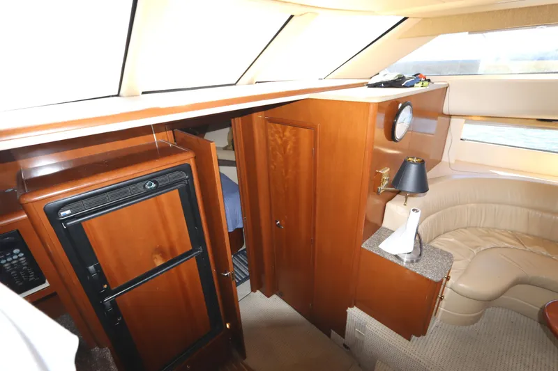 Slide: The Image of Interior of 2005 Meridian 459 Motoryacht with wood finishes and cozy seating area. - 39