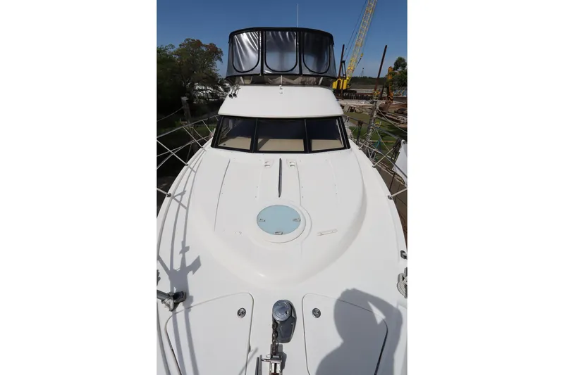 Slide: The Image of 2005 Meridian 459 Motoryacht, white exterior, docked with clear sky background. - 4