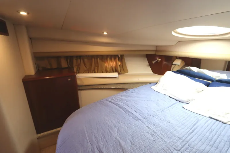 Slide: The Image of Interior cabin of 2005 Meridian 459 Motoryacht with cozy bed and ambient lighting. - 45