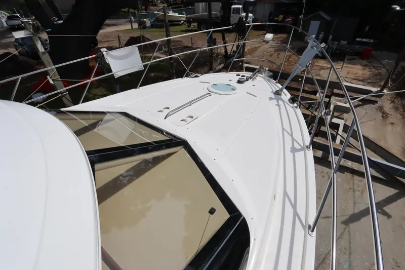 Slide: The Image of 2005 Meridian 459 Motoryacht deck view with railing and hatch. - 7