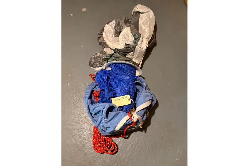 Slide: The Image of Vintage PAC 23 parachute from 1976, blue and gray fabric with red cords. - 13