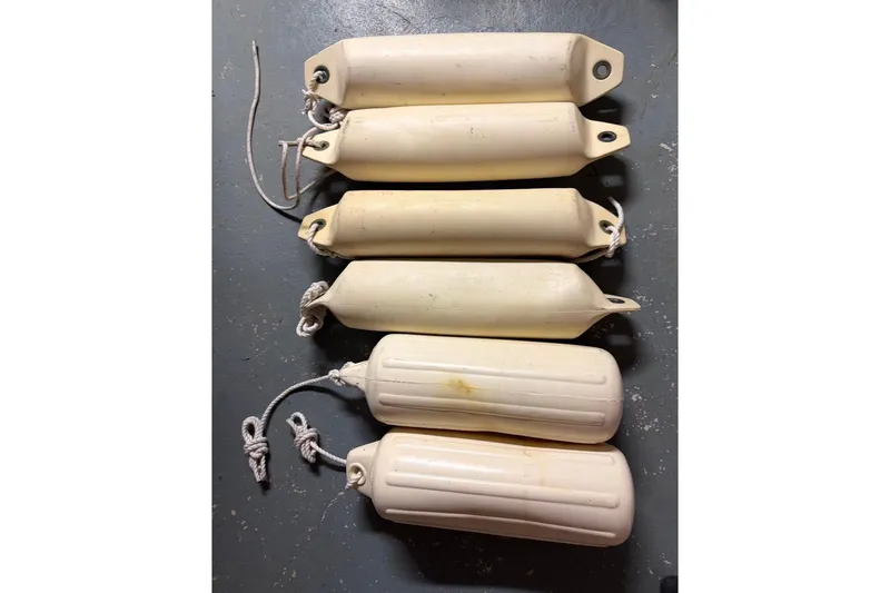 Slide: The Image of Six white boat fenders with ropes, PAC 23 model, 1976. - 16