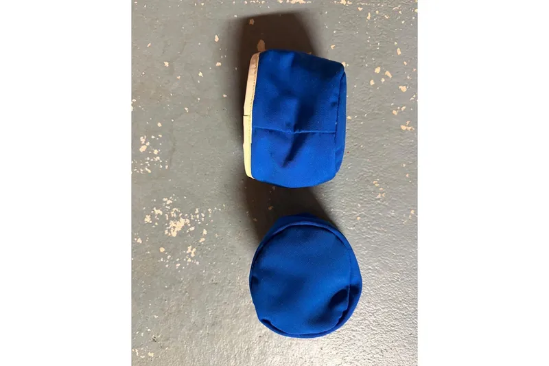 Slide: The Image of Blue padded items on a textured gray surface, PAC model 23, 1976. - 17