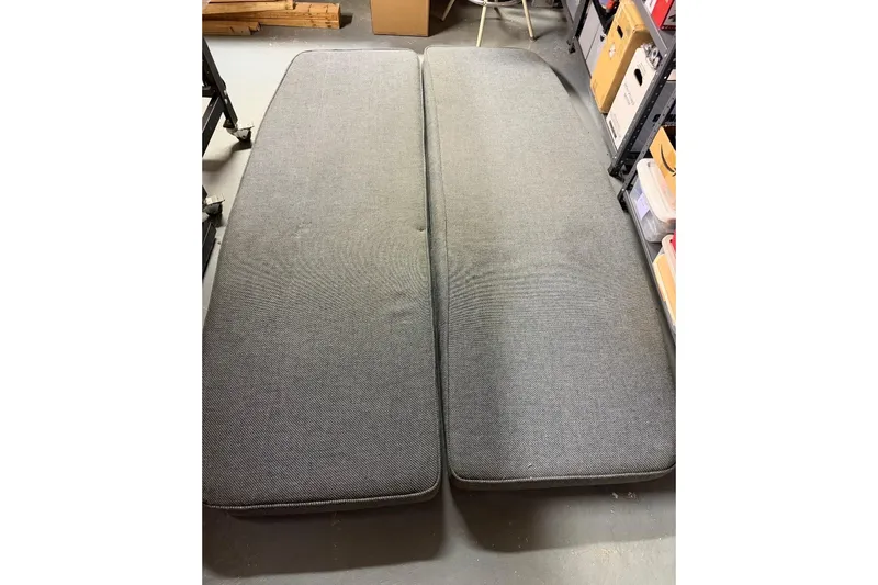 Slide: The Image of Gray cushions from a 1976 PAC 23, displayed on a workshop floor. - 5