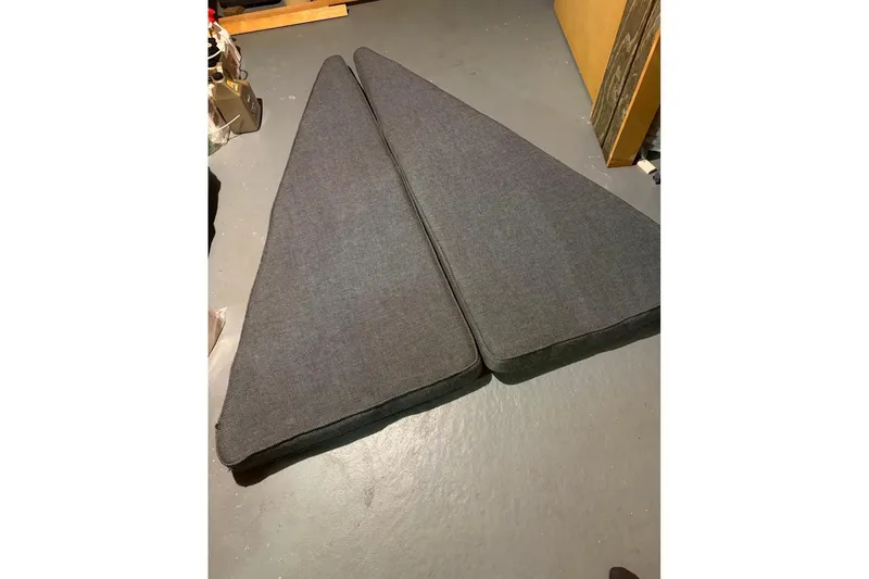 Slide: The Image of Two triangular gray cushions on a floor, PAC 23 model, 1976. - 7