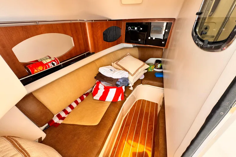 Slide: The Image of Interior cabin of 2014 Grady-White Freedom 335 boat with cozy seating and wooden flooring. - 28