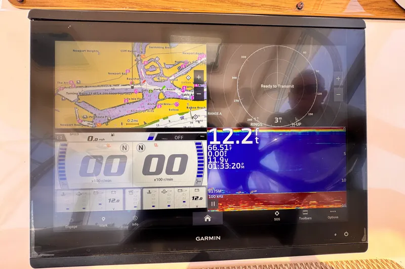 Slide: The Image of Garmin marine display on 2014 Grady-White Freedom 335, showing navigation and sonar data. - 34