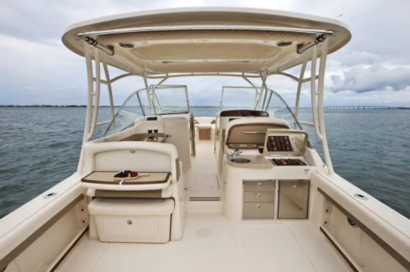 Slide: The Image of Manufacturer Provided Image: 2014 Grady-White Freedom 335 boat interior with helm and seating area. - 4