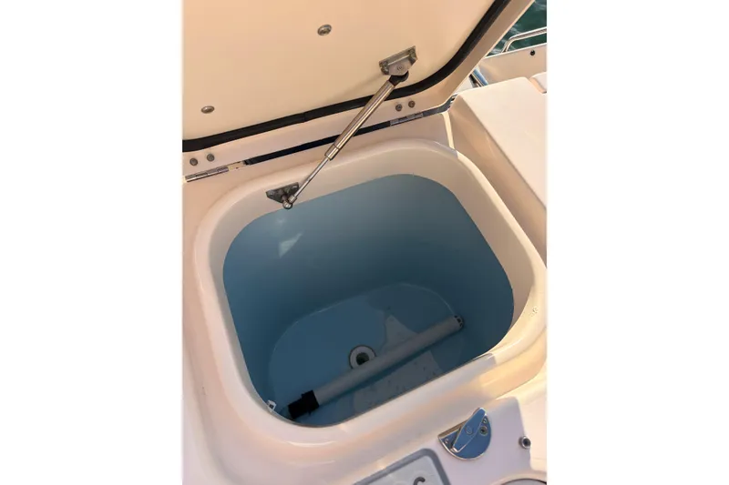 Slide: The Image of Open storage compartment on 2014 Grady-White Freedom 335 boat. - 45