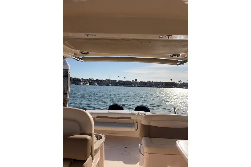 Slide: The Image of 2014 Grady-White Freedom 335 boat interior with ocean view and sunny sky. - 48