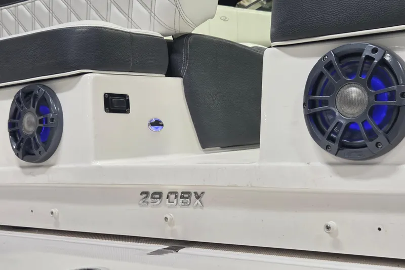Slide: The Image of 2019 Regal 29 OBX boat interior with speakers and seating detail. - 18