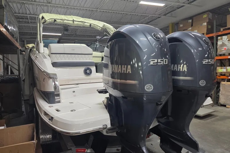 Slide: The Image of 2019 Regal 29 OBX boat with twin Yamaha 250 engines in storage. - 26