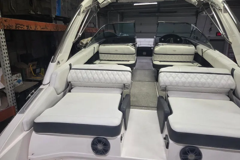 Slide: The Image of 2019 Regal 29 OBX boat interior with luxurious white seating and modern design. - 7
