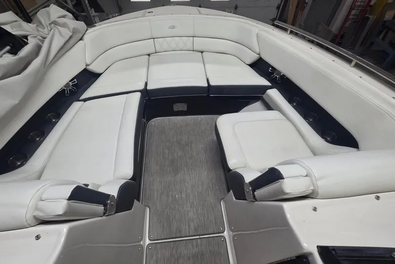 Slide: The Image of Luxurious seating area on a 2019 Regal 29 OBX boat with white upholstery. - 8