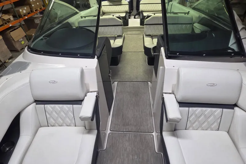 Slide: The Image of 2019 Regal 29 OBX boat interior with luxurious white seating and modern design. - 9