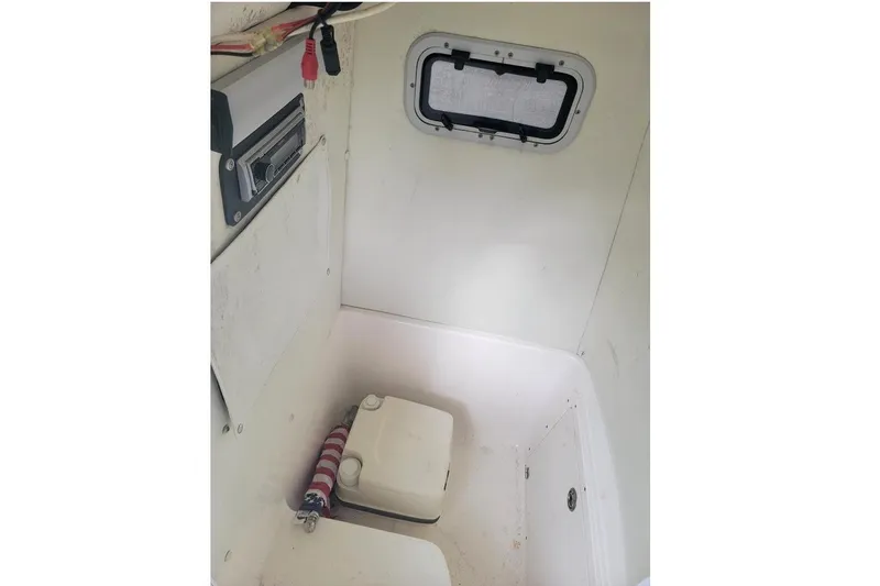 Slide: The Image of Interior of a 2004 Century 2200 Center Console boat with storage compartment. - 6
