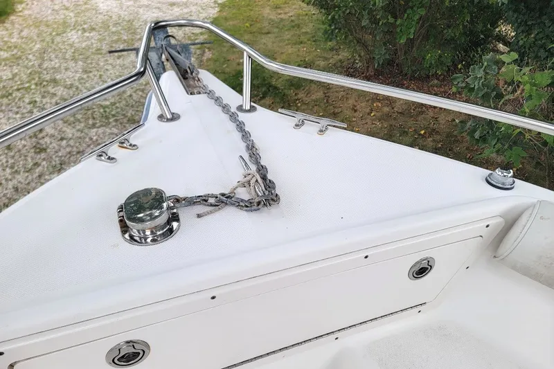 Slide: The Image of Bow of 2004 Century 2200 Center Console with anchor chain and railing. - 15