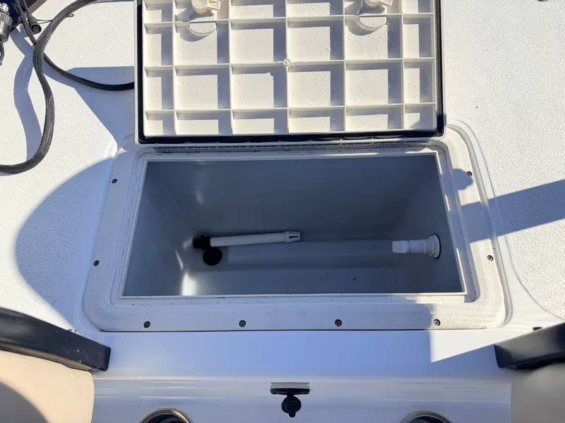 Slide: The Image of Open storage compartment on 2021 Hurricane Fun Deck 198 boat. - 15